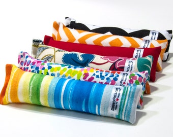 May include: Six colorful catnip toys with different patterns, including stripes, polka dots, and floral designs. Each toy has a label with the text "ZiggyPets.com" and the tagline "Happy Pet, Happy You!"