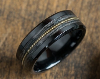 Black ceramic ring with gray oak and golden guitar string inlay - Black wedding band - Guitarist - Musician gift - Dark Rock&#39;n&#39;roll band