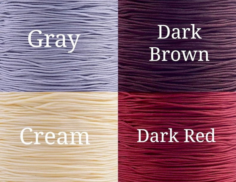 May include: Four spools of cord in different colors: gray, dark brown, cream, and dark red.