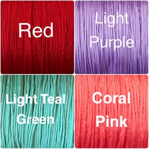 May include: Four spools of cord in different colors: red, light purple, light teal green, and coral pink.