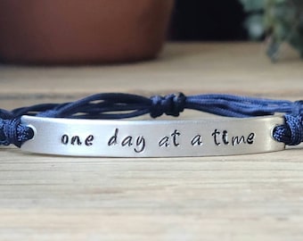 One Day At A Time | Hand Stamped Bracelet | Adjustable Aluminum Bar Bracelet | Nylon Cord Bracelet | Choose Color Band