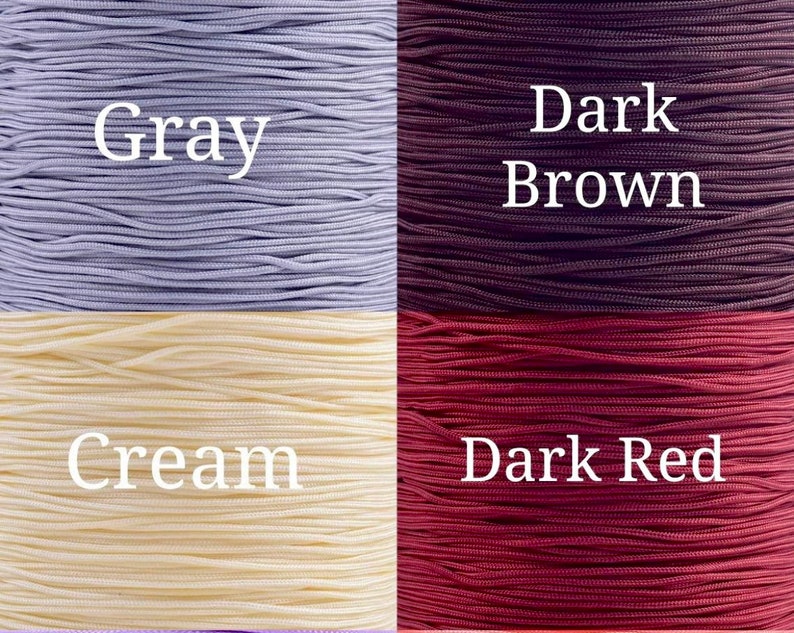 May include: Four spools of cord in different colors: gray, cream, dark brown, and dark red.