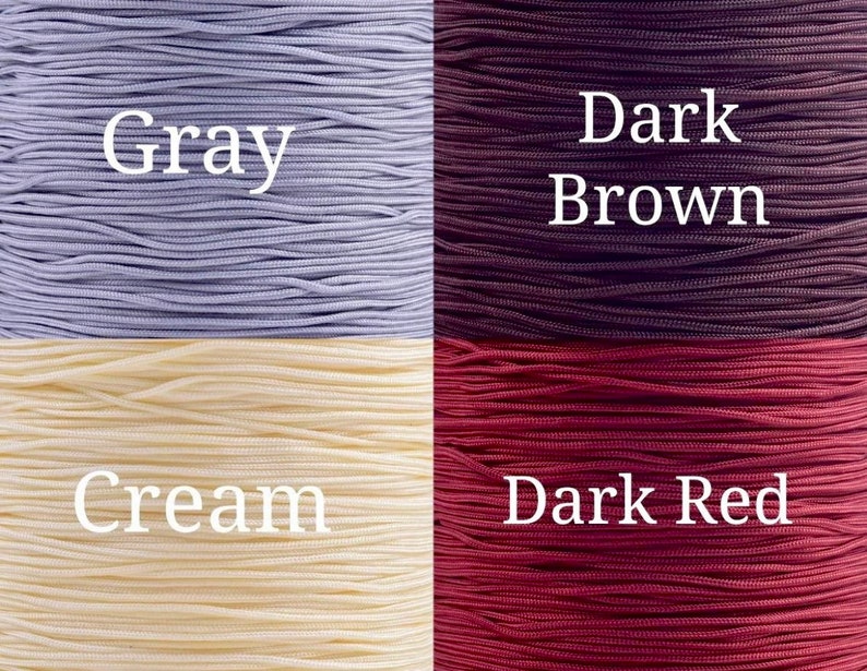May include: Four spools of cord in different colors: gray, dark brown, cream, and dark red.