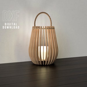 May include: A wooden lantern with a light inside. The lantern has a handle and is made of thin strips of wood. The lantern is sitting on a dark wood floor.  DXF DIGITAL DOWNLOAD