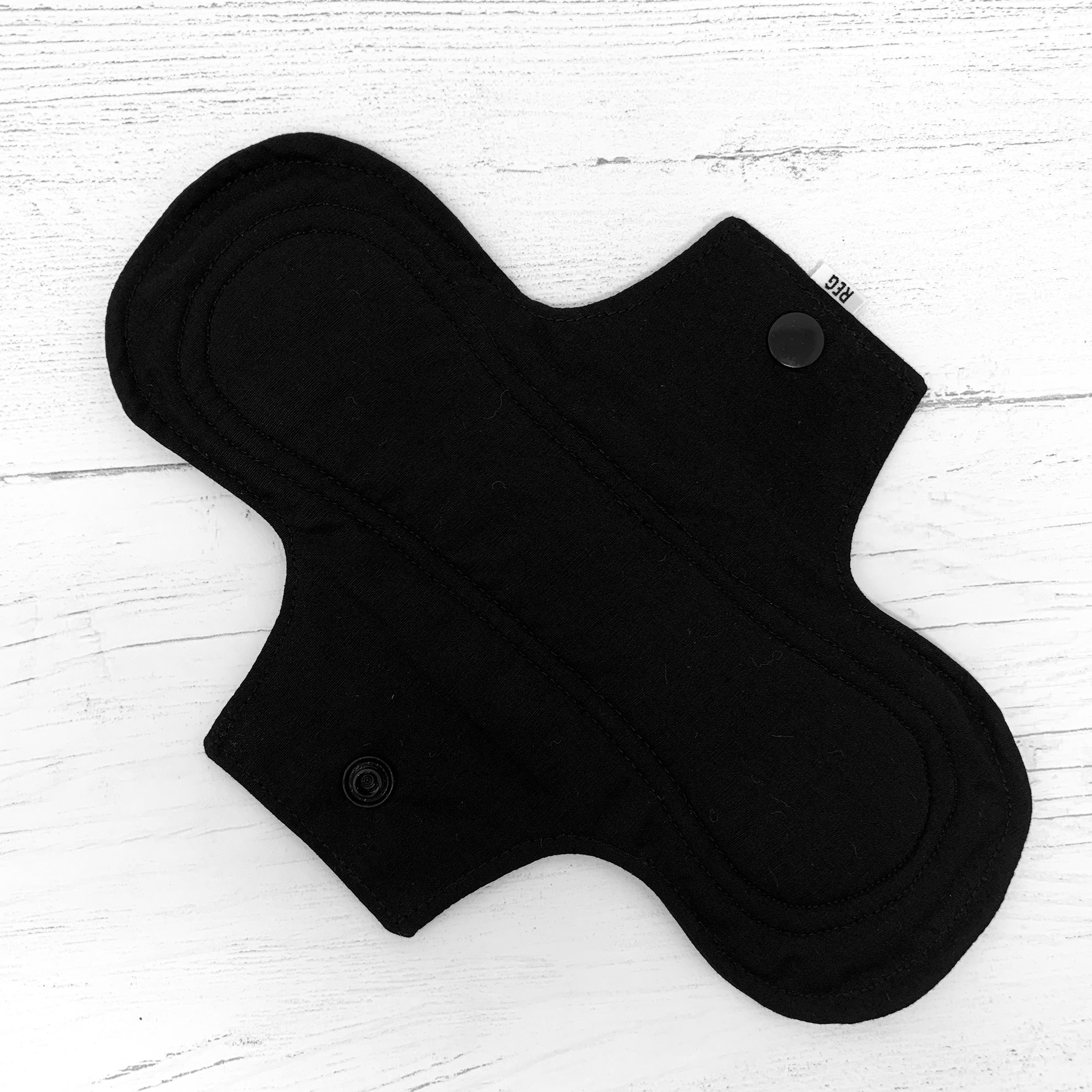 Reusable Cloth Menstrual Pad – Plain Black Fabric, Eco-Friendly, Vegan, Waterproof Option, 9” x 6”, UK, Sustainable Period Care