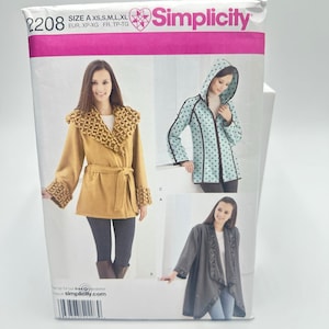 May include: A Simplicity sewing pattern envelope 2208 for sizes XS to XL. The front displays three jacket variations: a mustard yellow belted jacket with textured cuffs, a light blue hooded jacket with black polka dots, and a gray open-front jacket.