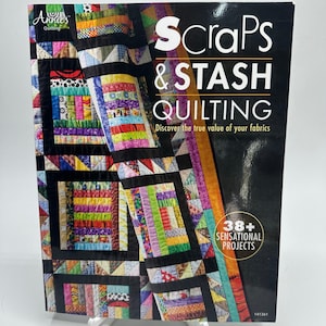 May include: A quilting book titled "Scraps & Stash Quilting" with a colorful quilt design on the cover. The cover also features the text "Discover the true value of your fabrics" and "38+ Sensational Projects".
