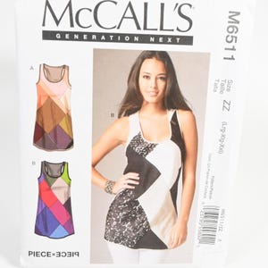 May include: McCall's M6511 sewing pattern envelope for a sleeveless tank top with a racerback design. The front displays illustrations of two color-blocked versions and a photograph of a black, white, and lace-patterned tank top.