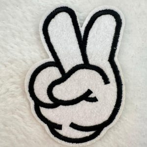 May include: A rustic wooden sign with the text "Welcome to our home" in white lettering. The sign features a distressed finish and a simple, inviting design, perfect for entryway decor.