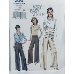 Könnte beinhalten: Very Easy Vogue Schnittmuster V8457, Größe EE (14-16-18-20). Der Umschlag zeigt Illustrationen von drei Outfits: ein hellblaues Hemd mit gestreifter Hose, ein beiger Rollkragenpullover mit dunkelbrauner Hose und ein weißer Rollkragenpullover mit beiger Hose.