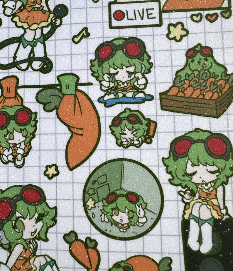 May include: A sticker sheet featuring a grid pattern background with multiple illustrations of a green-haired character wearing red goggles. The character is depicted in various poses, including crying, sitting, and interacting with orange carrots.