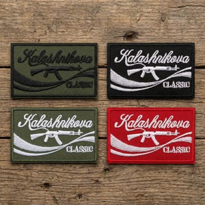 May include: Four rectangular patches with the text "Kalashnikova CLASSIC" and an illustration of a rifle. The patches are in black, red, green, and olive green, with white or black text and rifle illustrations.