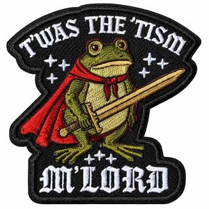 May include: Embroidered patch featuring a green frog in a red cape holding a gold sword. The patch has the text "T'WAS THE 'TISM" and "M'LORD" in white lettering on a black background. Decorative stars are also present.