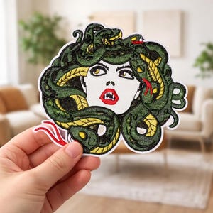 May include: A set of three ceramic mugs with a speckled, matte finish. The mugs are in shades of cream, light gray, and dark gray. Each mug has a simple, minimalist design, perfect for coffee or tea.