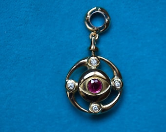 Ten Eyes Solar-Lunar Ruby-Sapphire Turn-around Medallion 21k Gold Diameter 21mm