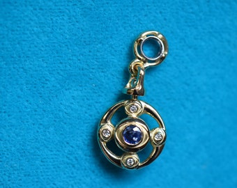 Ten Eyes Solar-Lunar Ruby-Sapphire Turn-around Medallion 21k Gold Diameter 15 mm