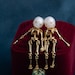 see more listings in the skull pearl earring section