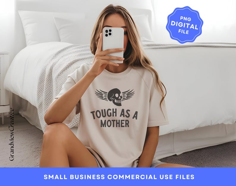 May include: A white t-shirt with a black skull and wings graphic and the text "Tough as a Mother".
