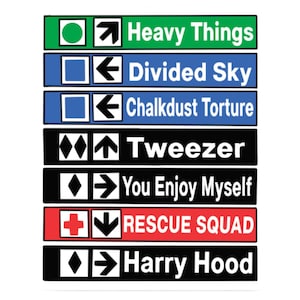 May include: A series of rectangular signs with white text on various colored backgrounds. The signs read "Heavy Things," "Divided Sky," "Chalkdust Torture," "Tweezer," "You Enjoy Myself," "Rescue Squad," and "Harry Hood."