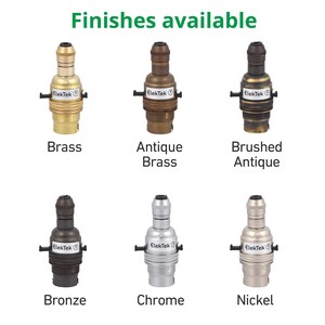 May include: Six different finishes of a light bulb socket, including brass, antique brass, brushed antique, bronze, chrome, and nickel.