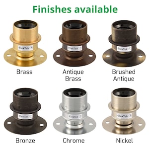 May include: Six different finishes of a metal lamp socket, including brass, antique brass, brushed antique, bronze, chrome, and nickel.