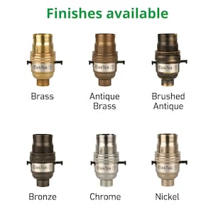 May include: Six different finishes of a light socket, including brass, antique brass, brushed antique, bronze, chrome, and nickel.