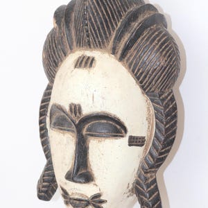 wooden mask. Baule tribal mask. Wall decor