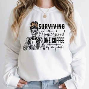 Surviving Motherhood One Coffee At A Time SVG | Skeleton Motherhood SVG | Mom Life SVG | Messy Bun Mom Coffee Shirt