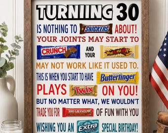 May include: A framed sign with black, red, and blue text reading "TURNING 30 IS NOTHING TO SNICKERS ABOUT! YOUR JOINTS MAY START TO CRUNCH AND YOUR WHATCHAMACALLIT MAY NOT WORK LIKE IT USED TO. THIS IS WHEN YOU START TO HAVE BUTTERFINGER PLAYS TWIX ON YOU! BUT NO MATTER WHAT, WE WOULDN'T TRADE YOU FOR 100 GRAND OF FUN WITH YOU WISHING YOU AN EXTRA SPECIAL BIRTHDAY!" featuring candy bar graphics.