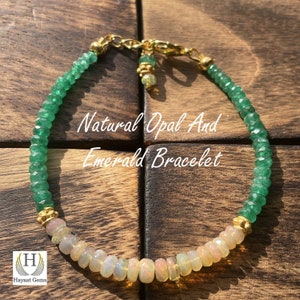 May include: A bracelet featuring natural opal and emerald beads. The bracelet has a gold chain and accents. The text "Natural Opal And Emerald Bracelet" is displayed on the image. The bracelet is on a wooden surface.