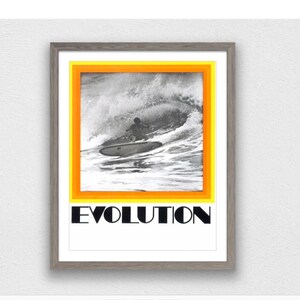 May include: A framed black and white photograph of a surfer riding a wave. The image is surrounded by a yellow and orange border. The word "EVOLUTION" is printed in black letters below the image.
