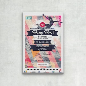 May include: A colorful poster advertising the Roxy Pro 2012 surfing competition in Biarritz, France. The poster features a surfer riding a wave, a graphic design of a wave, and the text "Roxy Pro 2012 Biarritz 10-14 juillet".