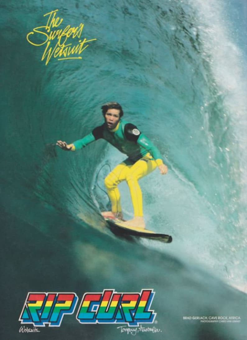 May include: A surfer wearing a green and yellow wetsuit rides a wave. The text "The Surf Wetsuit" is at the top of the image. The text "RIP CURL" is at the bottom of the image. The text "Torquay, Australia" is below the logo.