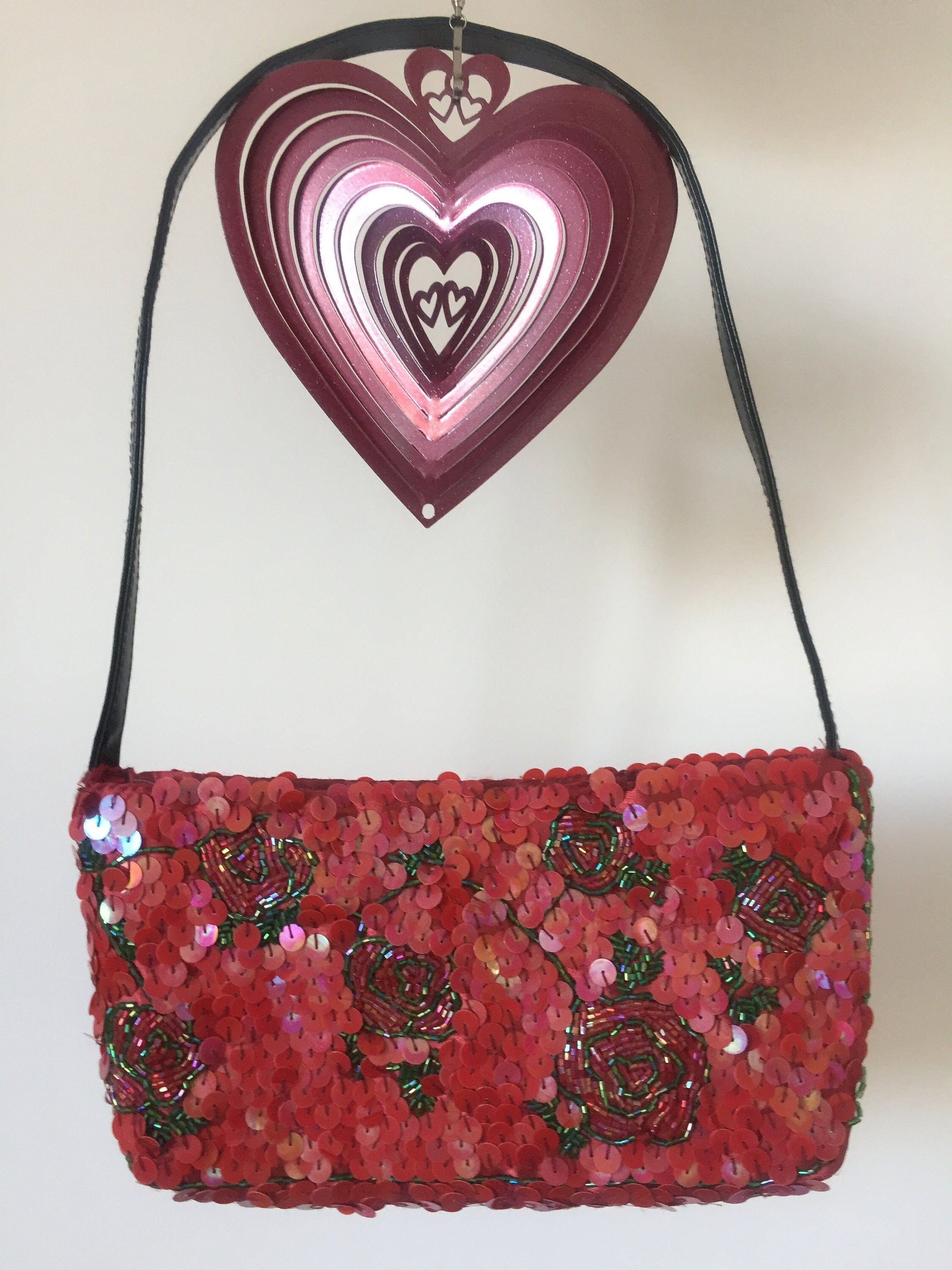 red sparkly evening bag