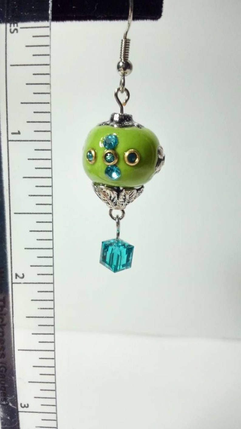10 Electric Green Hot Air Balloon Earrings with a crystal cube as the basket.