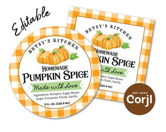 May include: Two labels with a pumpkin spice theme. One is round, the other rectangular, both with a white background and orange gingham borders. The labels read "Betsy's Kitchen Homemade Pumpkin Spice Made with Love". The round label is 236.6 ml.