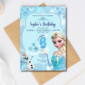 May include: A light blue birthday invitation featuring Elsa from Frozen. The invitation includes the text "Sophie's Birthday", date, time, and RSVP information. A brown envelope is behind the invitation.