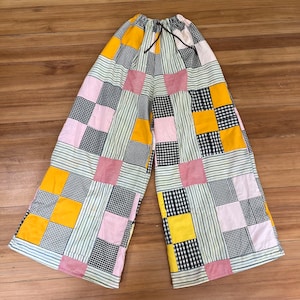 Yellow pants with checkered deals stripe