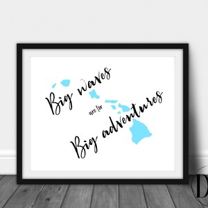 May include: A white framed print with a blue outline of the Hawaiian islands. The text "Big waves are for big adventures" is written in black cursive.