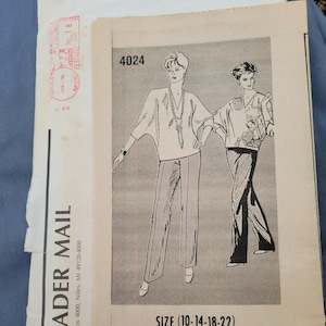 May include: A sewing pattern for a blouse with a v-neck and long sleeves. The pattern is for sizes 10-14-18-22. The pattern is called "Dressmaking" and the pattern number is 4024.