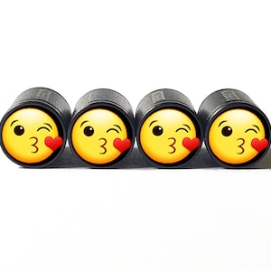 Face Blowing a Kiss Tire Valve Caps - Black Aluminum - Set of Four