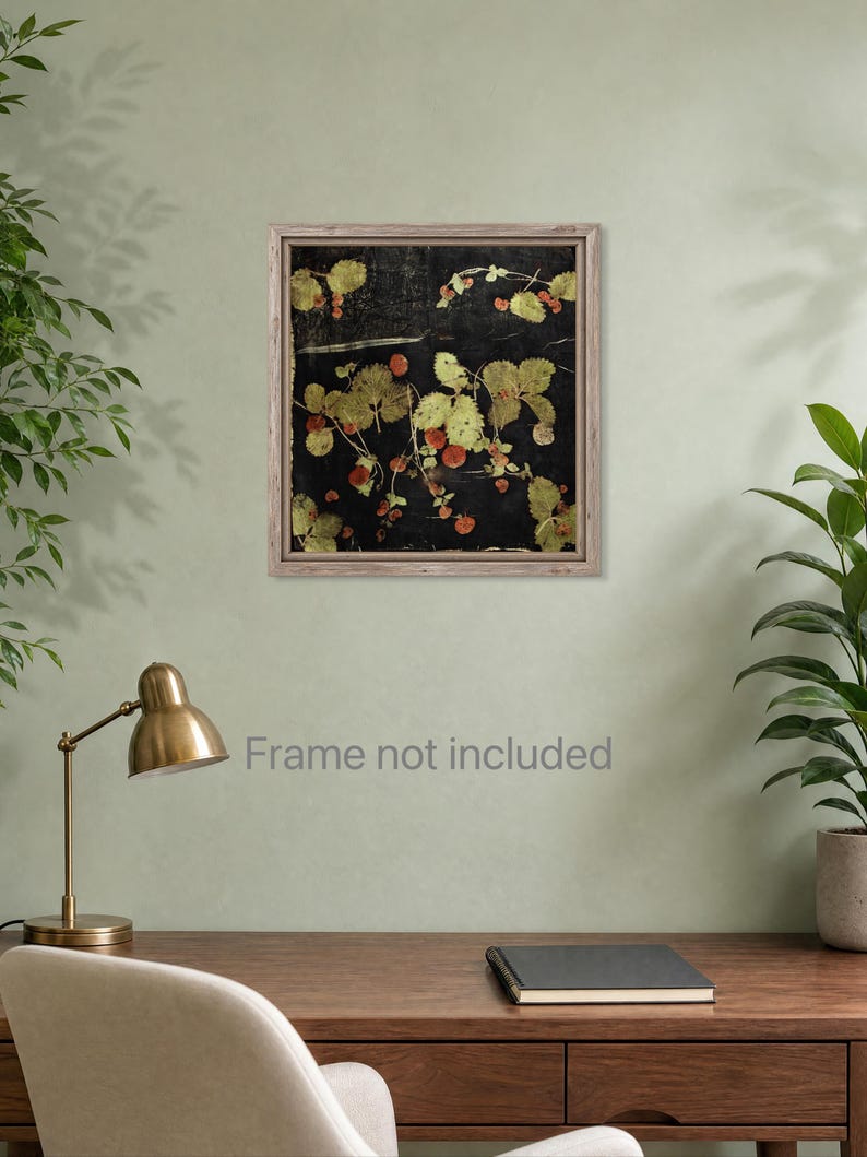 May include: A square wall art print featuring a botanical arrangement of pressed strawberry plants with green leaves and small red berries set against a solid black background, enclosed within a light brown wooden frame.