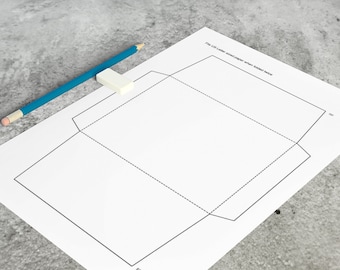 May include: Printable template for folding a US Letter size envelope. The template shows the fold lines and flap.