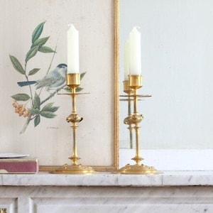A pair of vintage Bronze candlesticks (XIX)