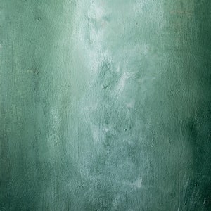 Op de afbeelding: Een getextureerde groene achtergrond met een vervaagd, lichter groen gebied in het midden.