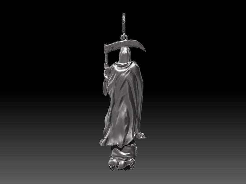 May include: A silver pendant depicting the Grim Reaper, holding a scythe. The figure is draped in a hooded cloak, standing atop a base with skulls. The pendant has a loop for a chain. The background is black.