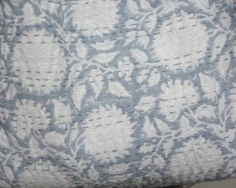 May include: A gray and white kantha quilt with a floral pattern. The quilt is made of cotton and has a hand-stitched design.