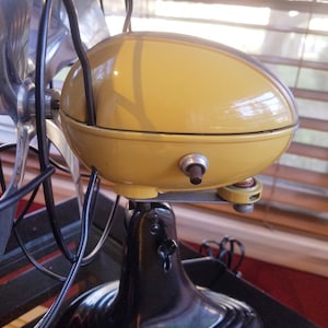 Vintage 1950's Westinghouse Electric fan, ocillating, one speed, art deco, professionally refurbished. Butterscotch yellow color.