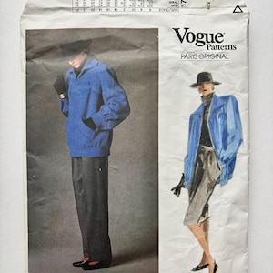 May include: A Vogue Patterns sewing pattern envelope for a Givenchy design, number 1787, size 12. The front features a photograph and an illustration of a person wearing a blue jacket, dark trousers, a black hat, and black gloves.