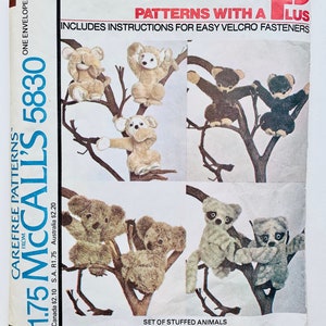 May include: A vintage sewing pattern for making a set of stuffed animals. The pattern includes instructions for easy Velcro fasteners. The pattern is for McCall's 5830 and costs £1.75. The pattern shows a variety of animals including monkeys, koalas, and raccoons.